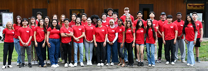 group of 30 students in red t-shirts