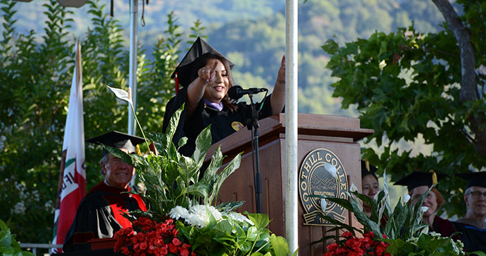 Female graduate speaking on stage