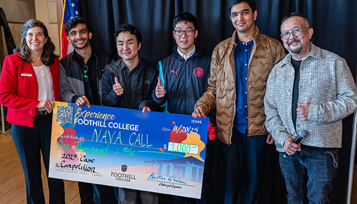 Winning team members with a check